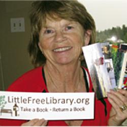 Bonnie Magnusson with Little Library promotional materials. 