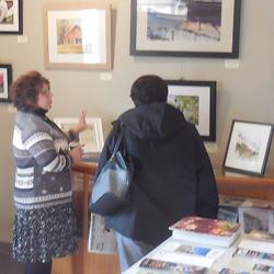 Kathy shows a visitor her work at our kick-off reception on Dec. 9