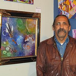 George Zantua with just a few of the artworks on display at Lakewood History Museum.