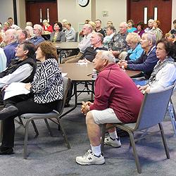 Among those attending, a couple (nearest camera) whose home is a converted Flett Dairy barn.