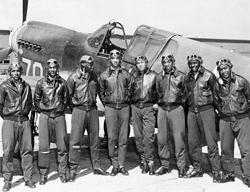 Tuskegee Airmen with trainer aircraft.