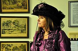Peggy Gross, current owner of the mansion, in appropriate Victorian finery.