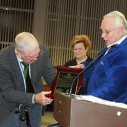 Lt. Gen. Bill Harrison (ret), receiving his plaque from Board Member Kris Kauffman.